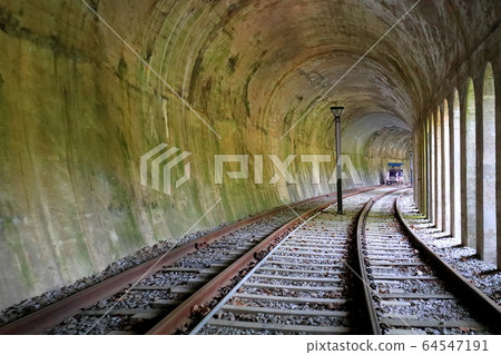 View of the railway tracks in the tunnel View of the railway tracks in the tunnel 64547191