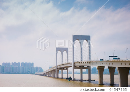 Sai Van bridge and modern buildings in Macau 64547565