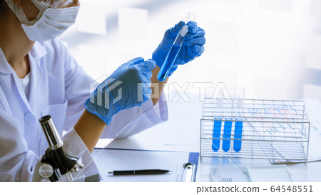 Scientist wear lab coat and protective wear are 64548551