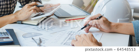 Cooperation Corporate designers in the office are Cooperation Corporate designers in the office are 64548553