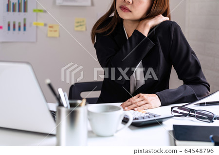 Stressed business woman suffering from shoulder and neck pain Stressed business woman suffering from shoulder and neck pain 64548796