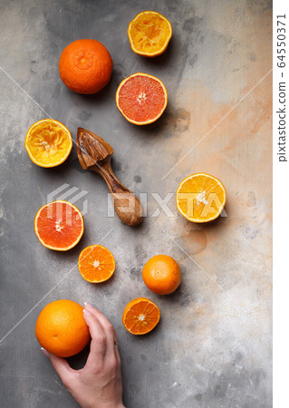 sliced lemons oranges and tangerines on a concrete sliced lemons oranges and tangerines on a concrete 64550371