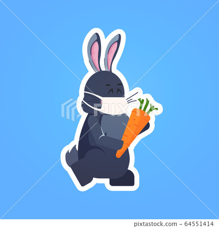 rabbit in mask holding carrot happy easter spring holiday coronavirus pandemic quarantine 64551414