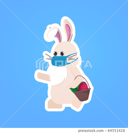 rabbit in mask holding basket with eggs happy easter spring holiday coronavirus pandemic quarantine 64551428