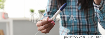 Person with pregnancy test 64551879