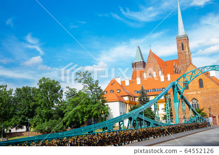 Most Tumski bridge and Ostrow Tumski Cathedral island in Wroclaw, Poland 64552126