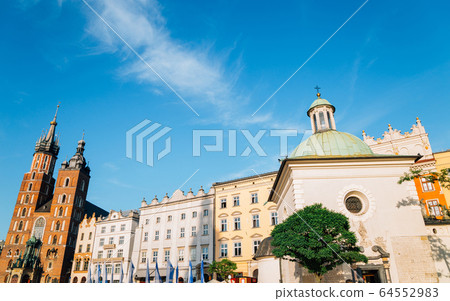 Church of St. Adalbert (Wojciech) and St. Mary's Basilica at Main Market Square (Rynek Glowny) in Krakow, Poland Church of St. Adalbert (Wojciech) and St. Mary's Basilica at Main Market Square (Rynek Glowny) in Krakow, Poland 64552983