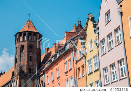 St. Nicholas Roman Catholic Church and old town buildings in Gdansk, Poland 64553538