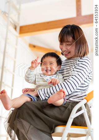Parents and children playing at home Infants spending time at home Parents and children playing at home Infants spending time at home 64553934