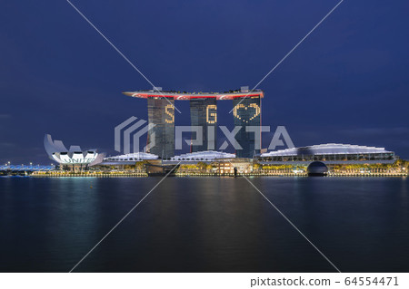 Marina Bay Sands Singapore lights up message in regards of fighting COVID-19, Singapore 64554471