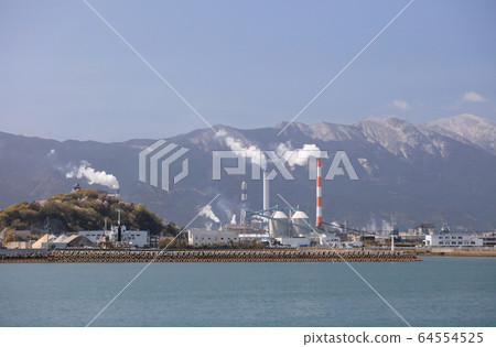 Kawanoe Castle in spring and the chimney of a paper mill seen from the Kawanoe Port side Kawanoe Castle in spring and the chimney of a paper mill seen from the Kawanoe Port side 64554525
