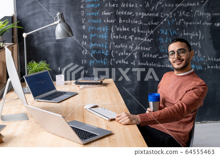 Young coder in own office Young coder in own office 64555463