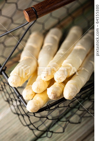White asparagus on wooden table 64555880