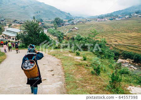 Hmong women and Lao Chai countryside village in Sapa, Vietnam Hmong women and Lao Chai countryside village in Sapa, Vietnam 64557398