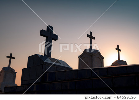 Cemetery or graveyard in the night with dark sky. 64559150