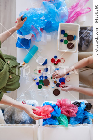 People Sorting Plastic at Home Top View People Sorting Plastic at Home Top View 64559360