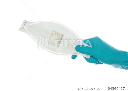 Doctor hand giving Medical mask isolated on white Doctor hand giving Medical mask isolated on white 64560437