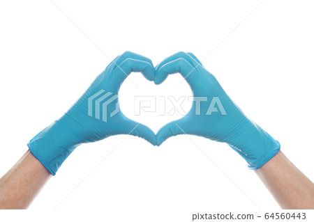 Hand in medical gloves showing heart isolated 64560443