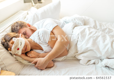 lovely cute couple sleep in the morning at home lovely cute couple sleep in the morning at home 64561537