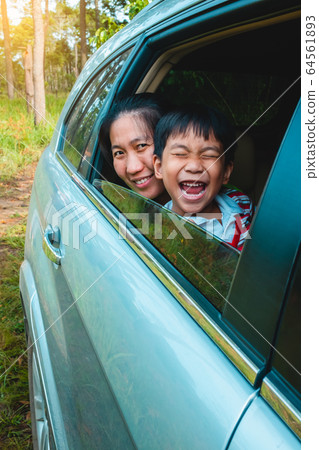 Family travelling by car. Asian mother and son having fun and laughing, travel on vacation. Family travelling by car. Asian mother and son having fun and laughing, travel on vacation. 64561893