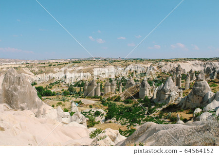 Cavusin old village, cave town in Cappadocia, Turkey 64564152