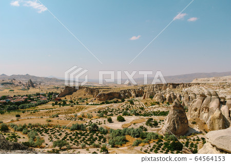 Cavusin old village, cave town in Cappadocia, Turkey Cavusin old village, cave town in Cappadocia, Turkey 64564153