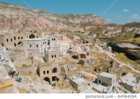 Cavusin old village, cave town in Cappadocia, Turkey 64564264