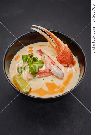Spicy soup with crab. Thai cuisine.  64565709