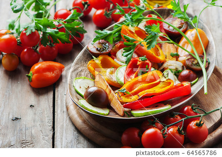 Grilled vegetables on the wooden table Grilled vegetables on the wooden table 64565786