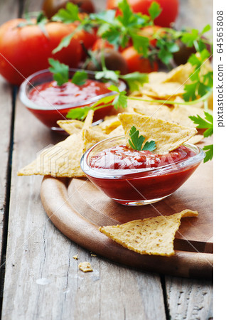 Concept of mexican food with spicy salsa 64565808
