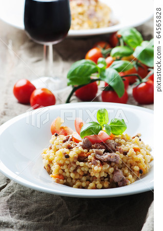Cooked sardinain pasta fregola with tomato and Cooked sardinain pasta fregola with tomato and 64565828