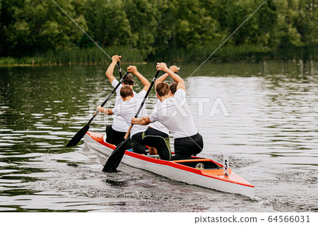 four man athletes canoeist paddling four man athletes canoeist paddling 64566031