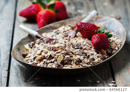 Homemade muesli with strawberry on the wooden 64566127