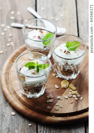 Healthy breakfast with muesli and yogurt Healthy breakfast with muesli and yogurt 64566371