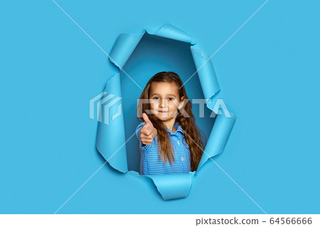 caucasian little cild girl showing thumbs up 64566666