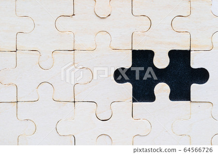 Close up wooden jigsaw puzzle pieces on black Close up wooden jigsaw puzzle pieces on black 64566726