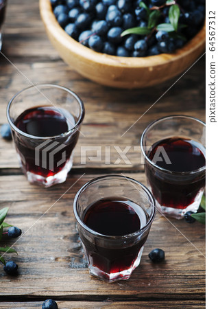 Traditional sardinian liqueur with mirto Traditional sardinian liqueur with mirto 64567312