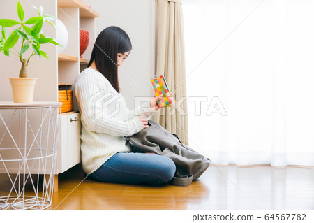 Woman who puts eyeglass case in backpack and takes out copy space 64567782