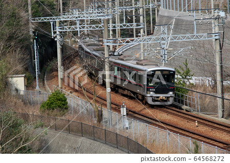 Kobe Electric Railway 6000 series 6001 formation train that runs fast toward the Kikusuiyama tunnel Kobe Electric Railway 6000 series 6001 formation train that runs fast toward the Kikusuiyama tunnel 64568272