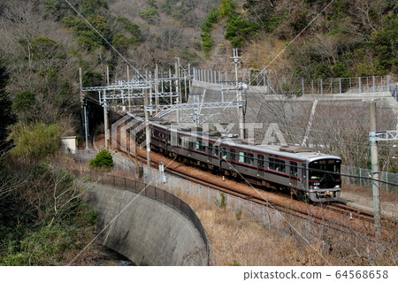 Kobe Electric Railway 6000 series 6001 train rolling toward the Kikusuiyama tunnel Kobe Electric Railway 6000 series 6001 train rolling toward the Kikusuiyama tunnel 64568658