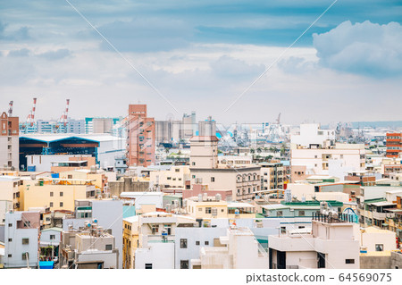 Colorful buildings under blue sky in Cijin island, Kaohsiung, Taiwan 64569075