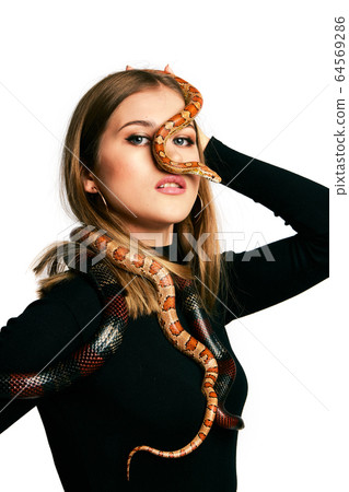 Beautiful woman in black bodywear and snake. Beautiful woman in black bodywear and snake. 64569286