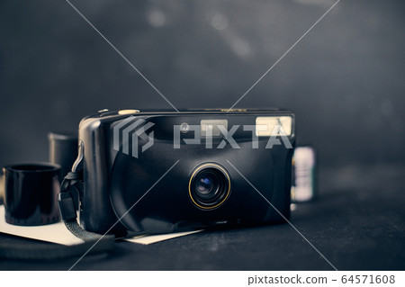 Old retro film camera. Old retro film camera. 64571608
