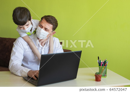 Father working from home with son. Homeschooling and freelance job concept. Corona days. 64572047