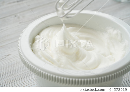 egg whites beaten to a frothy stage 64572919