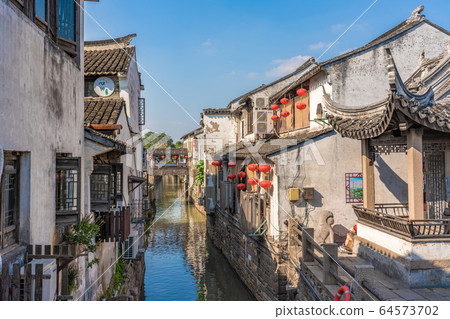 Ancient town architecture along the river Ancient town architecture along the river 64573702