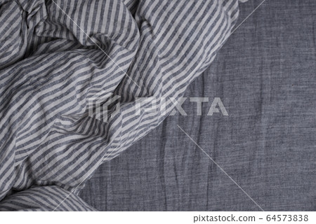 Bed with pillows and a blanket Bed with pillows and a blanket 64573838