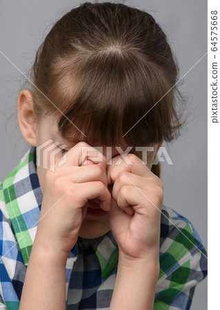 Portrait of a roaring ten-year-old girl of 64575668