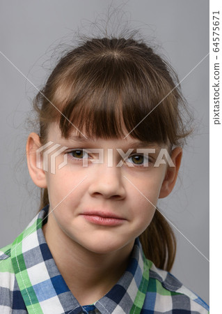 Portrait of a sad ten-year-old girl of European 64575671