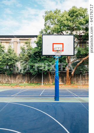 Basketball court in park 64576717